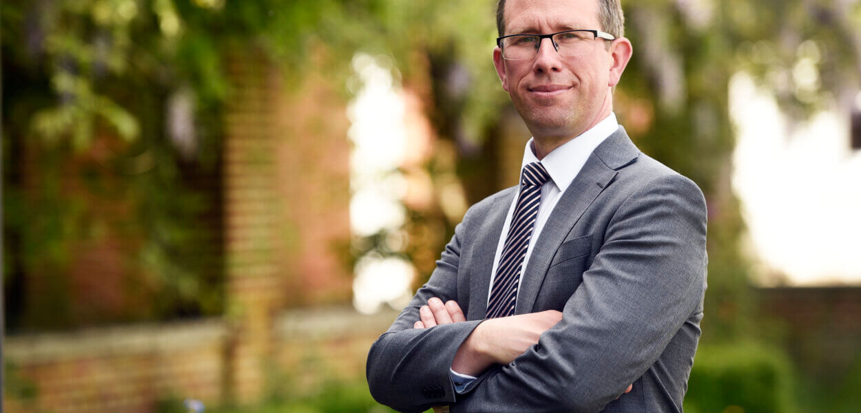 Matthew Barber stood outside with trees in background